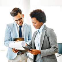colleagues reviewing documents together