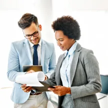 colleagues reviewing documents together