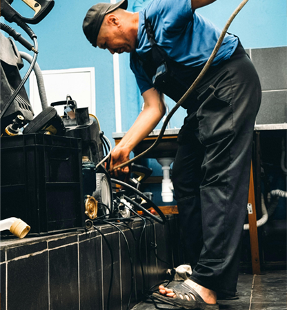 technician repairs industrial equipment