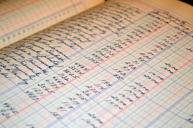handwritten accounting ledger book