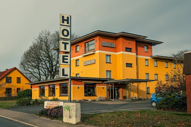 bright yellow roadside hotel building